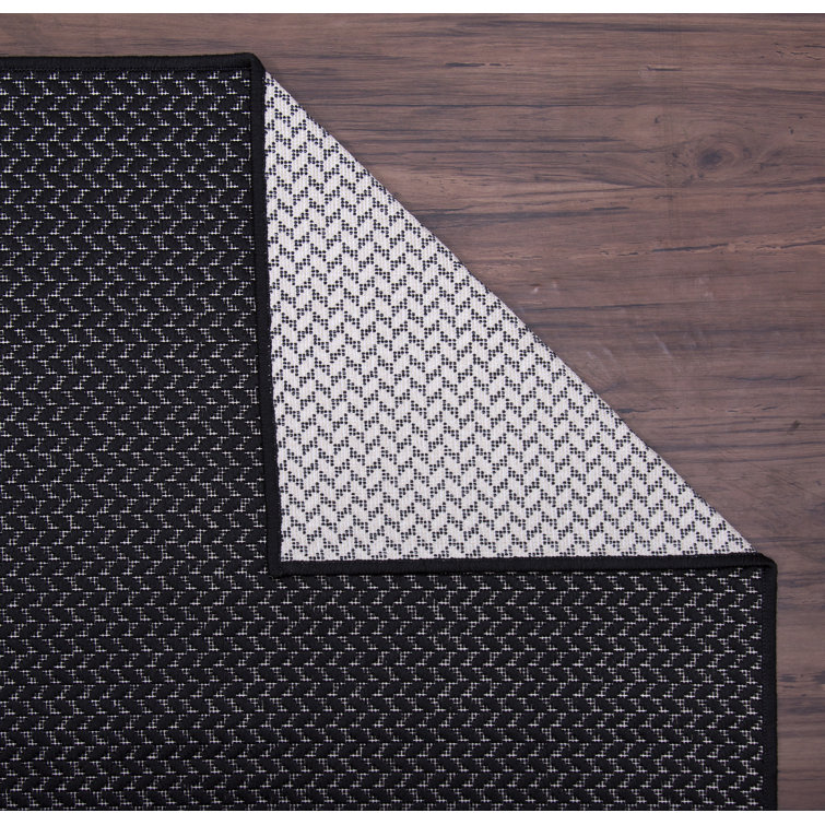 Corrigan Studio® Distressed Binded Black Indoor / Outdoor Area Rug
